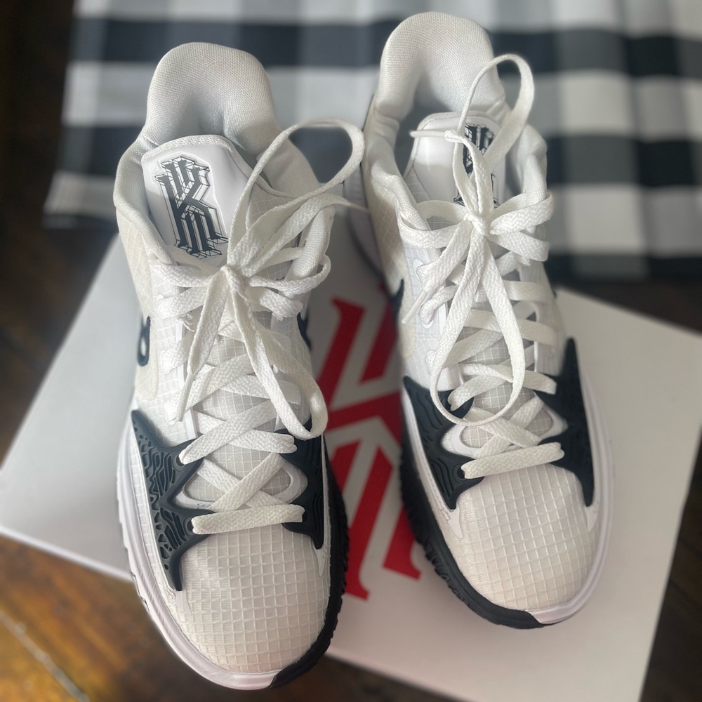 Black and white Kyrie tennis shoes